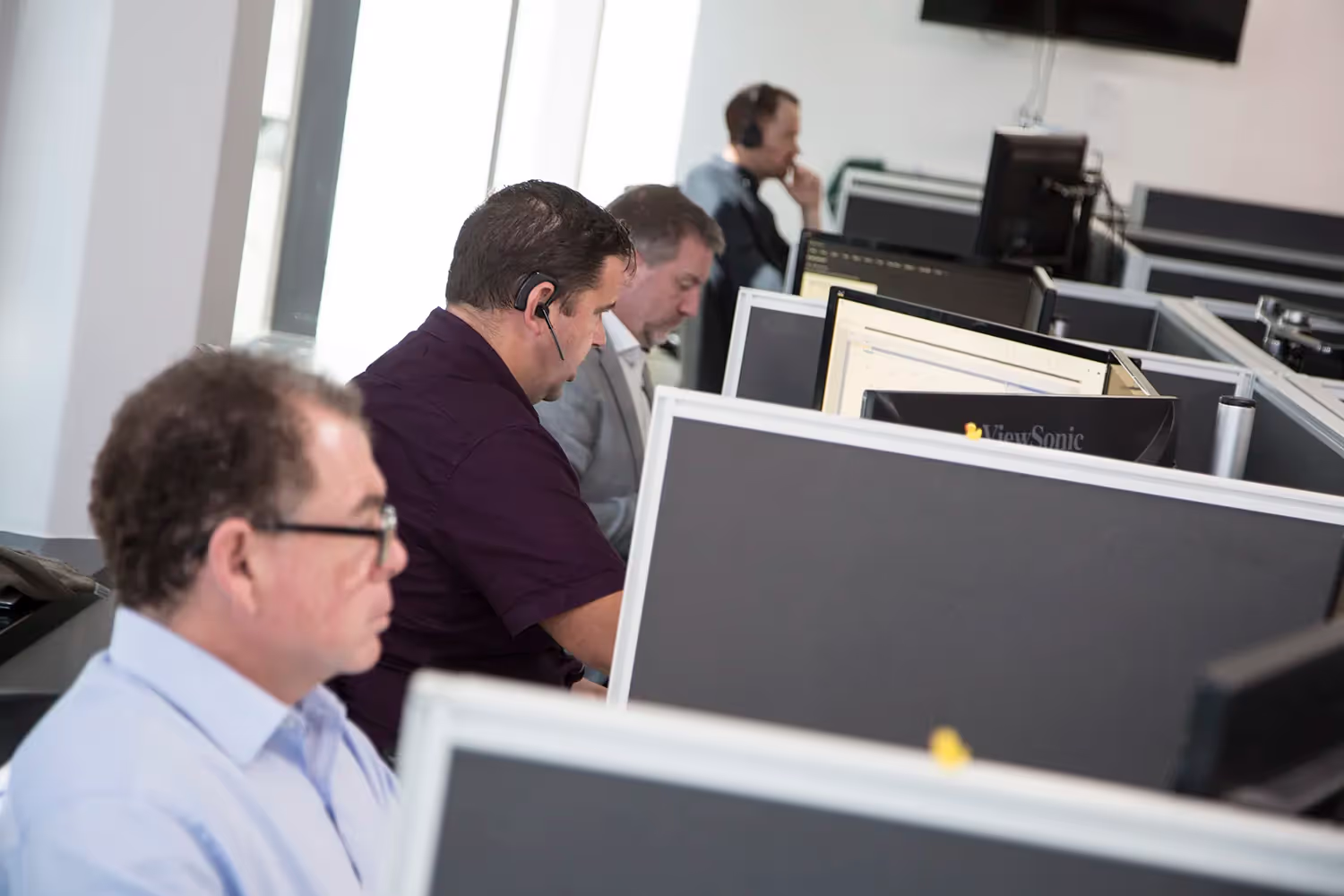 Business owner shaking hands with an IT service provider in Sydney, feeling confident and supported